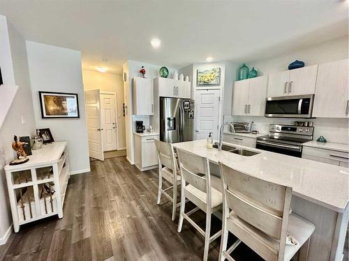 408-210 Firelight Way West, Lethbridge, AB - Indoor Photo Showing Kitchen With Stainless Steel Kitchen With Double Sink