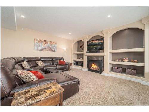 145 Sixmile Common South, Lethbridge, AB - Indoor Photo Showing Living Room With Fireplace