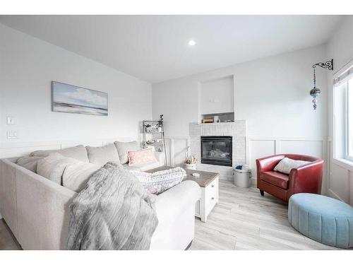 560 Aquitania Boulevard West, Lethbridge, AB - Indoor Photo Showing Living Room With Fireplace