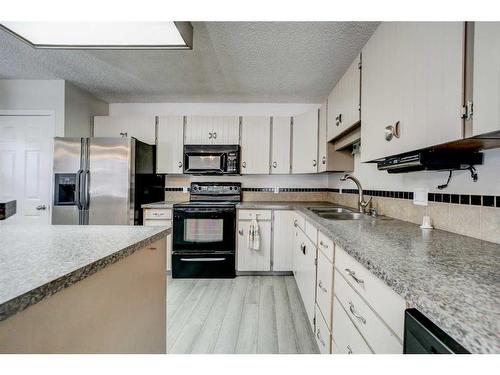 332 Leaside Avenue South, Lethbridge, AB - Indoor Photo Showing Kitchen With Double Sink