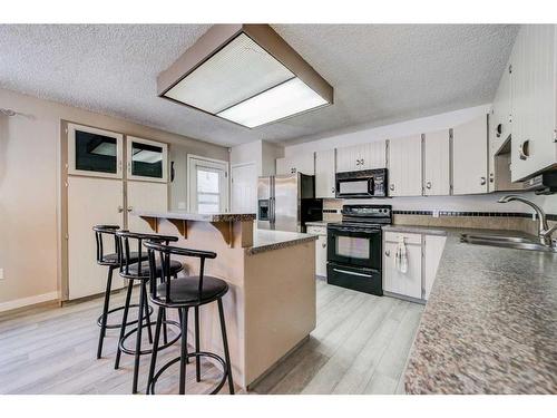 332 Leaside Avenue South, Lethbridge, AB - Indoor Photo Showing Kitchen With Double Sink