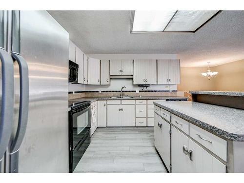 332 Leaside Avenue South, Lethbridge, AB - Indoor Photo Showing Kitchen With Double Sink