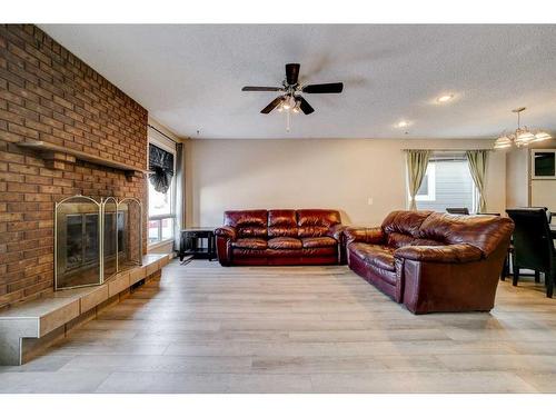 332 Leaside Avenue South, Lethbridge, AB - Indoor Photo Showing Living Room With Fireplace