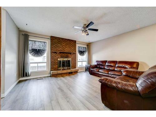 332 Leaside Avenue South, Lethbridge, AB - Indoor Photo Showing Living Room With Fireplace