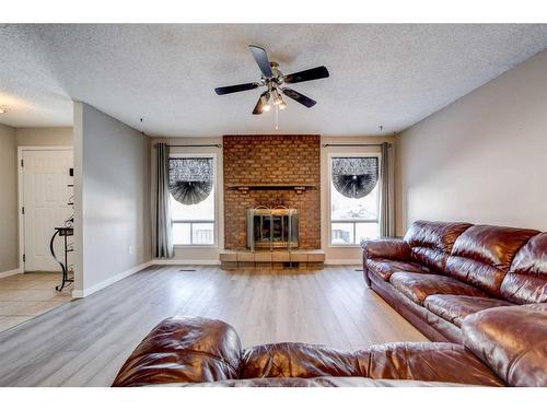 332 Leaside Avenue South, Lethbridge, AB - Indoor Photo Showing Living Room With Fireplace