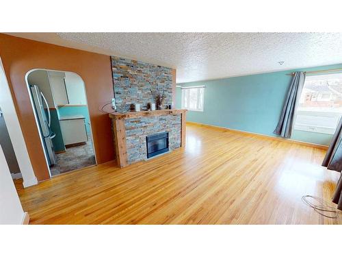 1304 18 Street South, Lethbridge, AB - Indoor Photo Showing Living Room With Fireplace