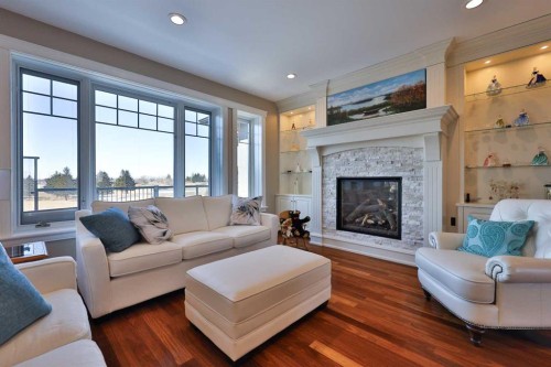 28 Cobblestone Lane, Raymond, AB - Indoor Photo Showing Living Room With Fireplace