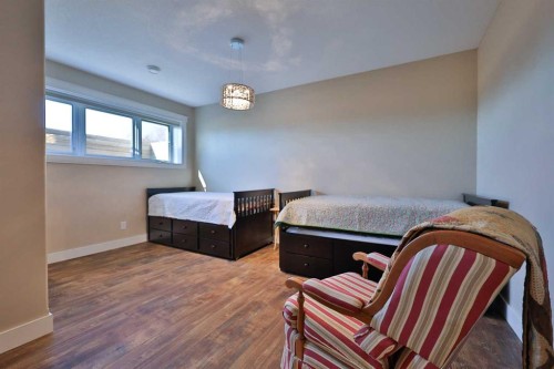 28 Cobblestone Lane, Raymond, AB - Indoor Photo Showing Bedroom