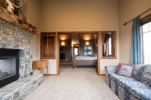 195041 Highway 512, Rural Lethbridge County, AB - Indoor Photo Showing Living Room With Fireplace