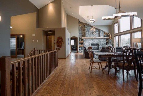 195041 Highway 512, Rural Lethbridge County, AB - Indoor Photo Showing Dining Room With Fireplace