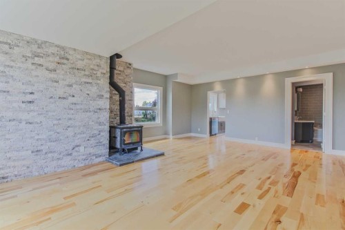 96S 100W, Raymond, AB - Indoor With Fireplace