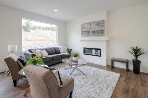 8615 25 Avenue, Coleman, AB - Indoor Photo Showing Living Room With Fireplace