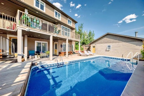 340 Tartan Circle West, Lethbridge, AB - Outdoor With In Ground Pool With Deck Patio Veranda With Exterior