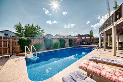 340 Tartan Circle West, Lethbridge, AB - Outdoor With In Ground Pool With Backyard