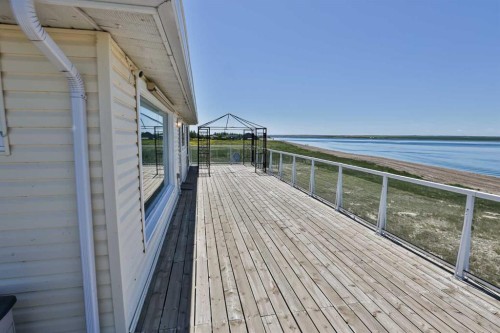 174068 Range Road 214, Rural Vulcan County, AB - Outdoor With Body Of Water With Deck Patio Veranda With Exterior