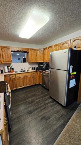 207 Centre Avenue Ne, Milk River, AB - Indoor Photo Showing Kitchen With Stainless Steel Kitchen With Double Sink