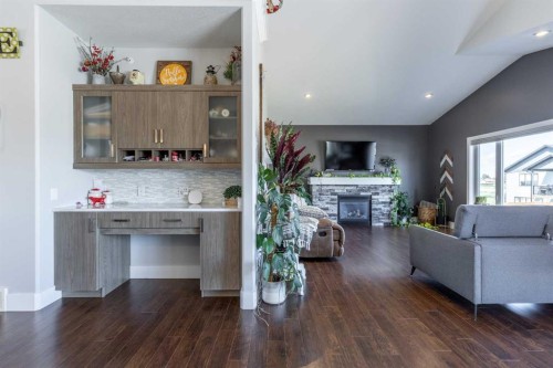 5401 43 Street, Taber, AB - Indoor Photo Showing Living Room With Fireplace