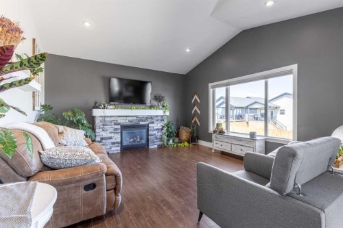 5401 43 Street, Taber, AB - Indoor Photo Showing Living Room With Fireplace