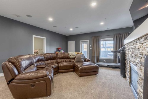5401 43 Street, Taber, AB - Indoor Photo Showing Living Room With Fireplace