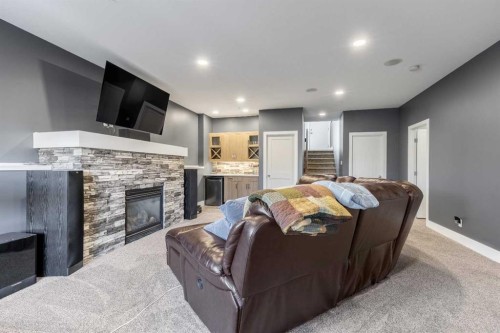 5401 43 Street, Taber, AB - Indoor Photo Showing Living Room With Fireplace