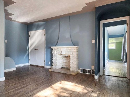 611 9 Avenue North, Lethbridge, AB - Indoor Photo Showing Living Room With Fireplace