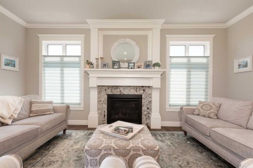 1 Edgemoor Way West, Lethbridge, AB - Indoor Photo Showing Living Room With Fireplace