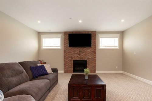 1 Edgemoor Way West, Lethbridge, AB - Indoor Photo Showing Living Room With Fireplace