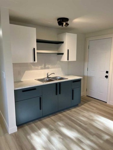 4932 57 Avenue, Taber, AB - Indoor Photo Showing Kitchen With Double Sink