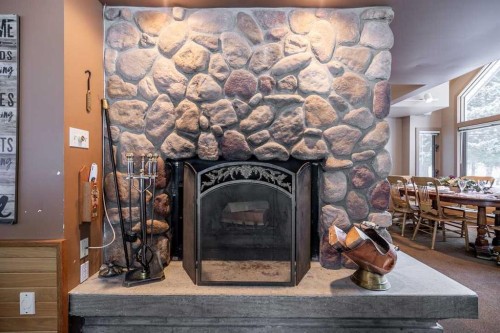 107 Mount View, Waterton Park, AB - Indoor With Fireplace