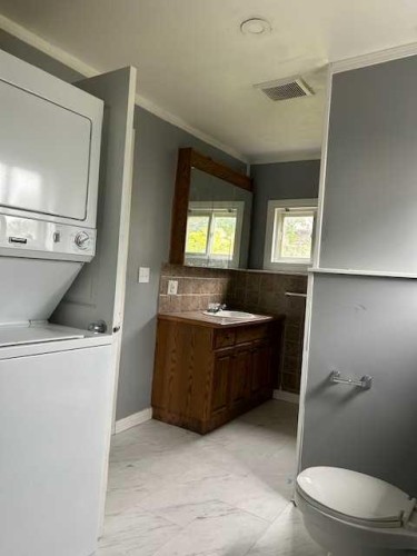 2012 18 Avenue, Coaldale, AB - Indoor Photo Showing Laundry Room