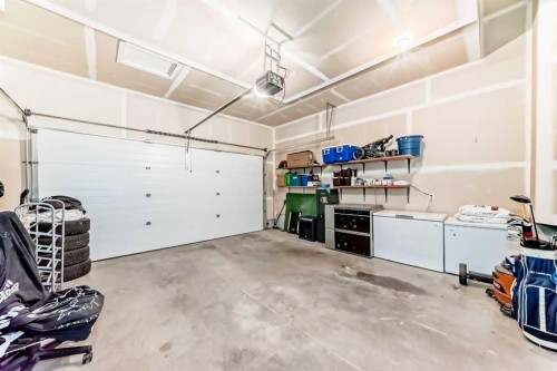673 Aquitania Boulevard West, Lethbridge, AB - Indoor Photo Showing Garage