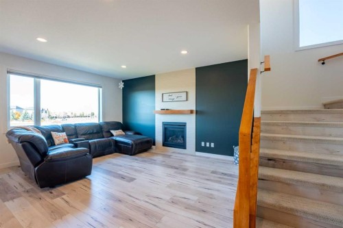 421 Rivergrove Chase West, Lethbridge, AB - Indoor Photo Showing Living Room With Fireplace
