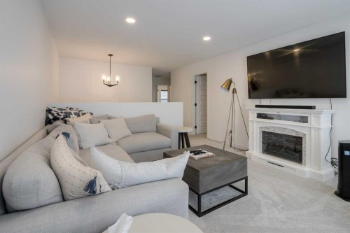 122 Greywolf Road North, Lethbridge, AB - Indoor Photo Showing Living Room With Fireplace
