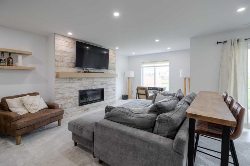122 Greywolf Road North, Lethbridge, AB - Indoor Photo Showing Living Room With Fireplace