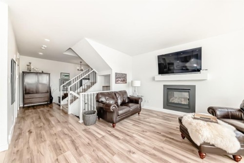 56 Greywolf Road North, Lethbridge, AB - Indoor Photo Showing Living Room With Fireplace