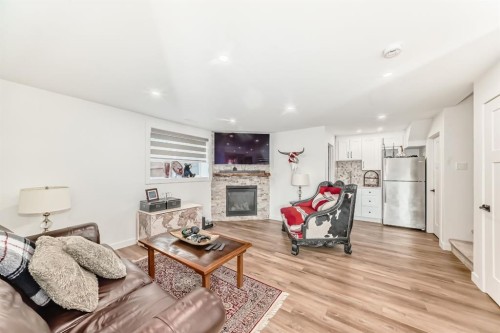 56 Greywolf Road North, Lethbridge, AB - Indoor Photo Showing Living Room With Fireplace