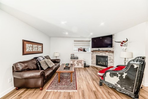 56 Greywolf Road North, Lethbridge, AB - Indoor Photo Showing Living Room With Fireplace