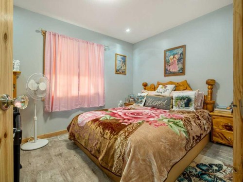 51 N 2 Street East, Hill Spring, AB - Indoor Photo Showing Bedroom