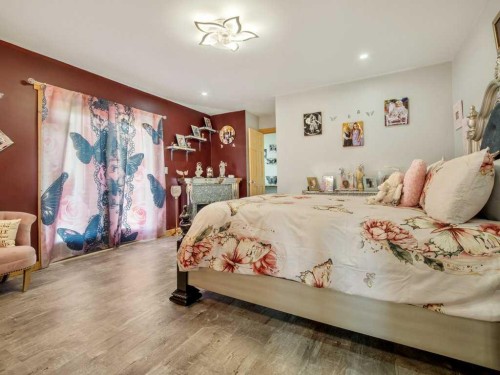 51 N 2 Street East, Hill Spring, AB - Indoor Photo Showing Bedroom