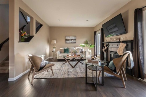 733 Twinriver Loop West, Lethbridge, AB - Indoor Photo Showing Living Room With Fireplace