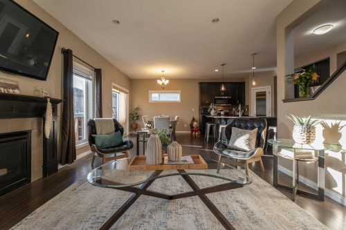 733 Twinriver Loop West, Lethbridge, AB - Indoor Photo Showing Living Room With Fireplace