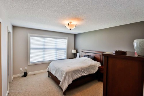 2-77 Aquitania Circle West, Lethbridge, AB - Indoor Photo Showing Bedroom