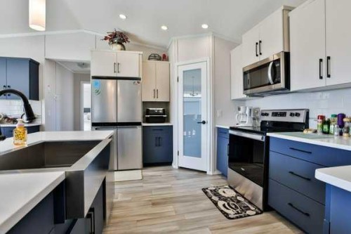 2037 Sunflower Crescent, Coaldale, AB - Indoor Photo Showing Kitchen With Stainless Steel Kitchen With Upgraded Kitchen
