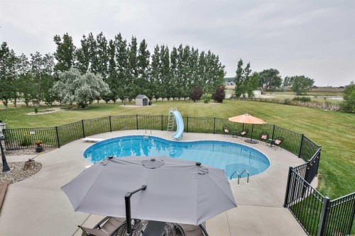 104 Buenavista Bay, Rural Lethbridge County, AB - Outdoor With In Ground Pool With Backyard