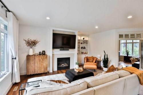 104 Buenavista Bay, Rural Lethbridge County, AB - Indoor Photo Showing Living Room With Fireplace