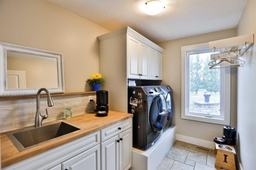 104 Buenavista Bay, Rural Lethbridge County, AB - Indoor Photo Showing Laundry Room