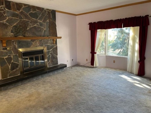 210 5 Street, Warner, AB - Indoor With Fireplace