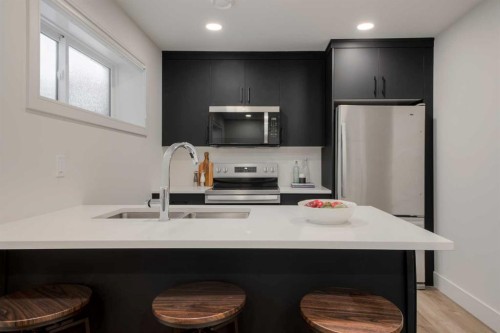 2545 16 Avenue North, Coaldale, AB - Indoor Photo Showing Kitchen With Stainless Steel Kitchen With Double Sink With Upgraded Kitchen
