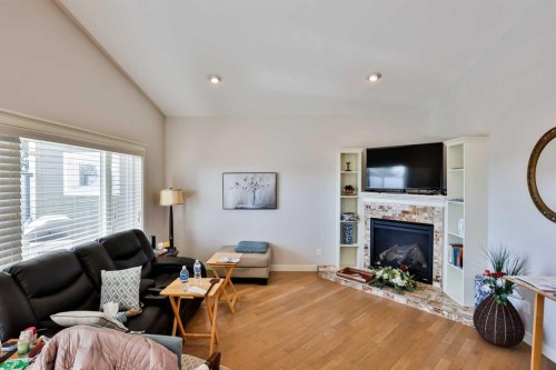 244 Sixmile Common South, Lethbridge, AB - Indoor Photo Showing Living Room With Fireplace