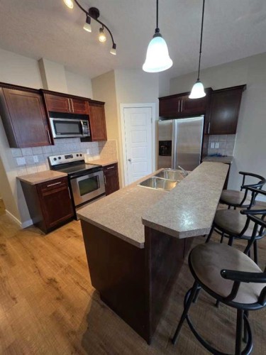 2216 18 Avenue, Coaldale, AB - Indoor Photo Showing Kitchen With Stainless Steel Kitchen With Double Sink
